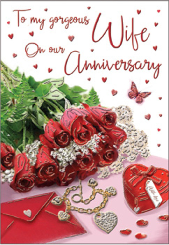 The card design unfolds like a personal anniversary vignette set in the heart of Feltham, where thoughtful details speak louder than grand gestures. Dominating the scene is a cluster of classic red roses, their petals luxuriantly full and arranged in a way that suggests the practiced hand of a professional florist. Each bloom radiates a deep, velvety crimson, the kind of colour that instantly evokes romance and devotion. The roses are cradled by glossy, textured foliage, the greens varied in shape and size, adding depth and a natural, garden-fresh feel reminiscent of nearby green spaces such as Hanworth Park. Just to the side, an envelope lies partially tucked beneath the flowers, hinting at an intimate handwritten message inside. A heart-shaped keepsake box in rich, reflective red rests close by, its smooth surface and rounded form suggesting a treasured piece of jewellery or small memento. A fine chain or pendant stretches gently across the surface, capturing glints of light that echo the gold and silver tones often chosen for anniversary gifts. Scattered over the background are tiny hearts and a delicate butterfly motif, their shapes and shadows creating a sense of gentle motion as they frame the card's flowing script. The lighting is soft but focused, drawing out the sheen of the petals and metal and the crisp edges of the paper, much like natural window light illuminating a quiet room just before an evening celebration. Altogether, the scene conveys warmth, tenderness, and the enduring comfort of shared years-an invitation to pause and appreciate love's everyday beauty in a Feltham home.